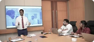 Team presenting in a meeting room