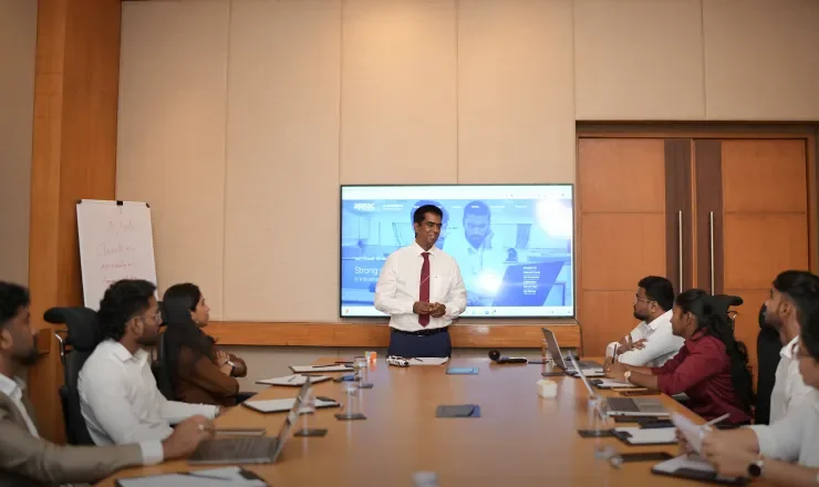 Appac Media team discussion in conference room